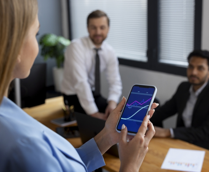 person-looking-finance-graphs